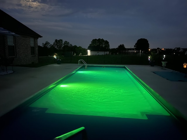 view of pool with a patio area, a fenced in pool, and fence