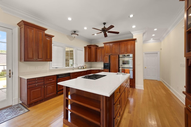 kitchen featuring ceiling fan, a center island, stainless steel double oven, dishwashing machine, and black electric stovetop