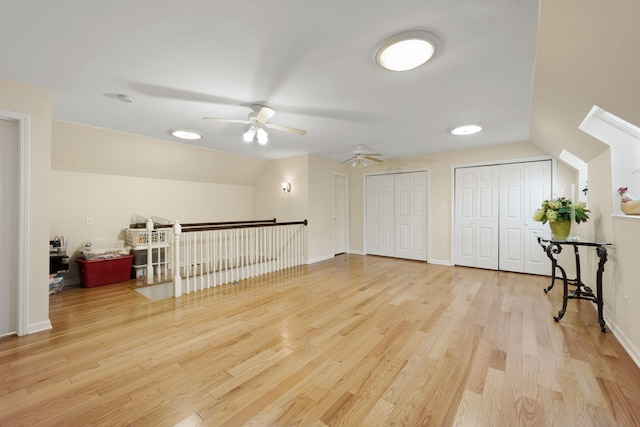 bonus room with light hardwood / wood-style floors, vaulted ceiling, and ceiling fan