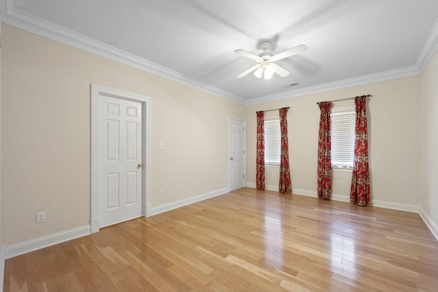 empty room with ceiling fan, light hardwood / wood-style floors, and crown molding