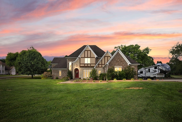 tudor house featuring a yard