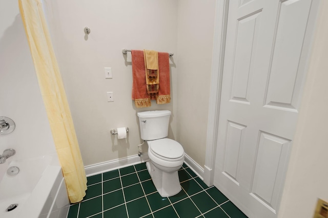 bathroom featuring tile patterned flooring, toilet, and shower / bath combo with shower curtain