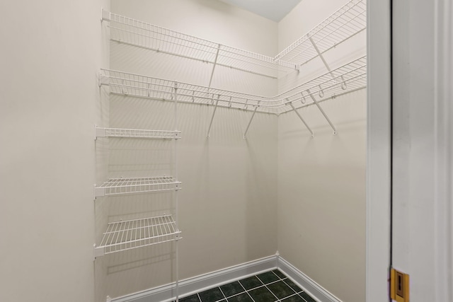 spacious closet featuring tile patterned floors