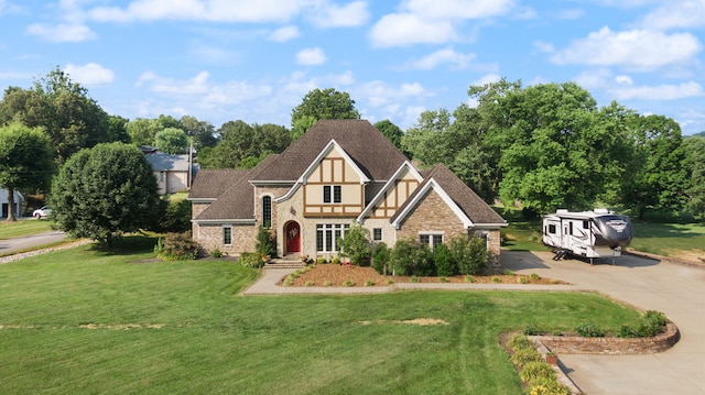 tudor house with a front lawn