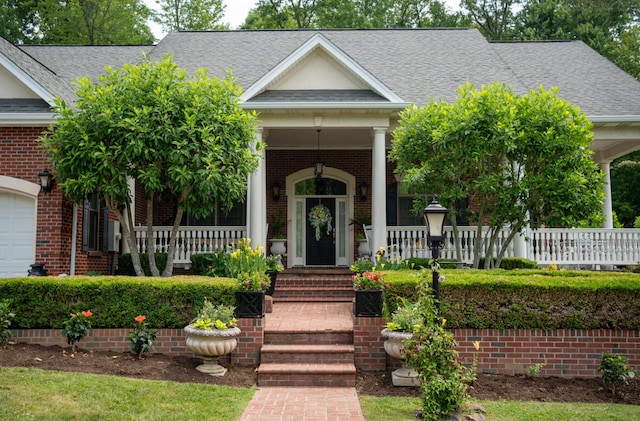 view of front of house with a garage and covered porch