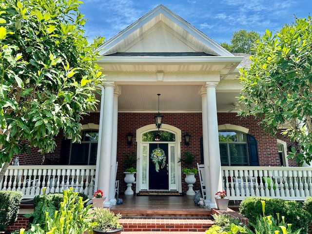 entrance to property featuring covered porch