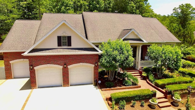 view of front of home with a garage and a porch