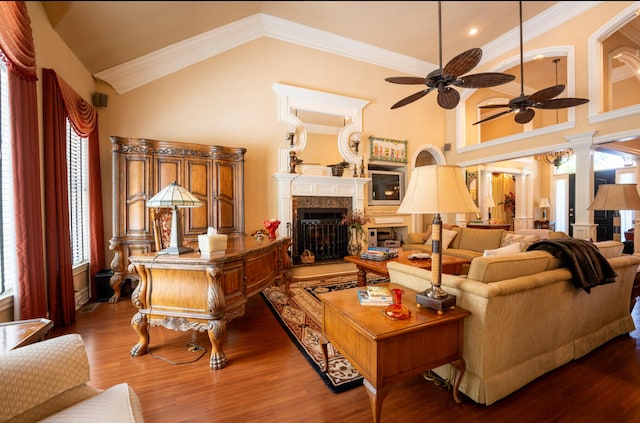 living room with ceiling fan, a healthy amount of sunlight, crown molding, and hardwood / wood-style flooring