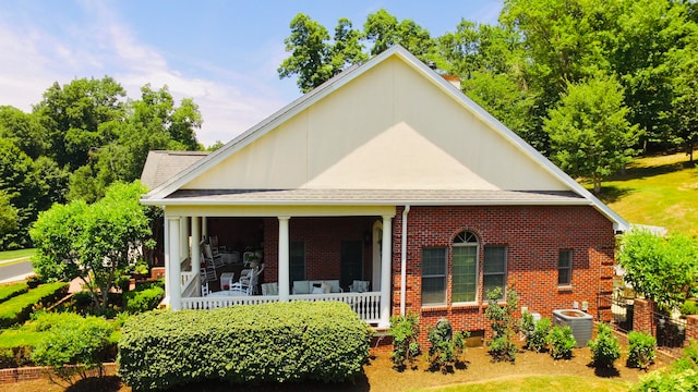 exterior space with a porch and central air condition unit