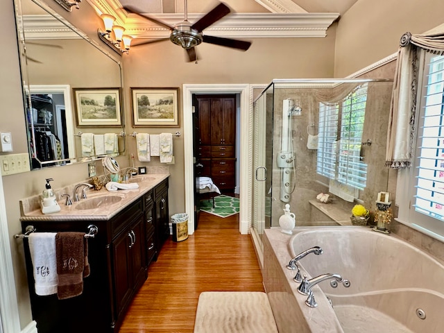 bathroom featuring ceiling fan, shower with separate bathtub, vanity, and hardwood / wood-style floors