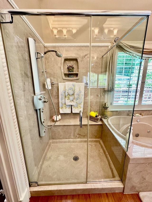 bathroom with hardwood / wood-style floors and separate shower and tub