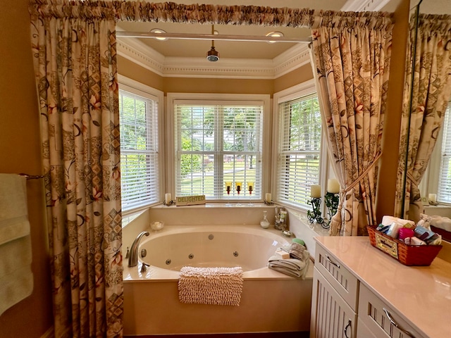 bathroom with crown molding and a bathing tub