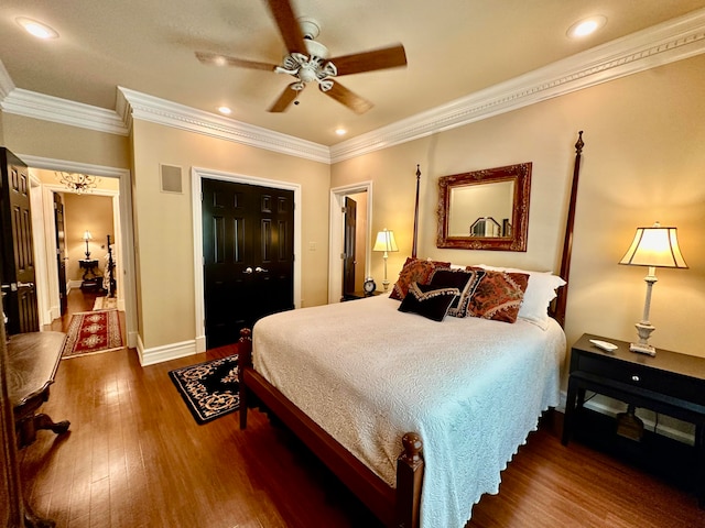 bedroom featuring ornamental molding, ceiling fan, and dark hardwood / wood-style floors