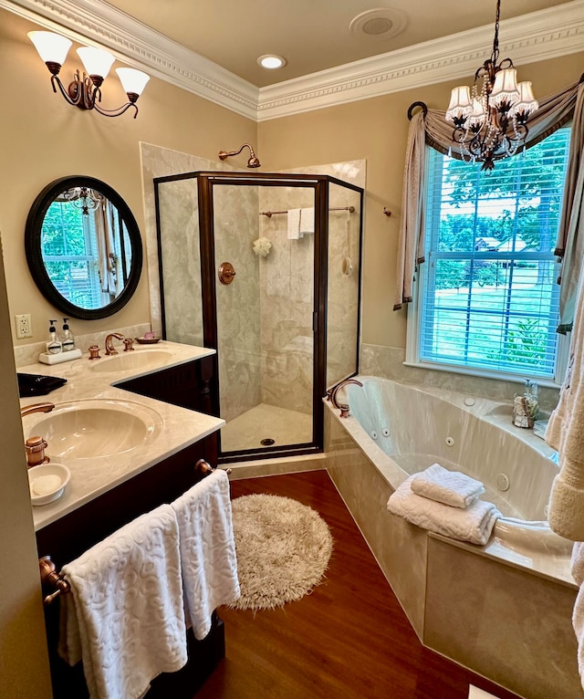 bathroom featuring ornamental molding, plus walk in shower, hardwood / wood-style floors, dual vanity, and a notable chandelier