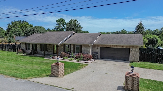 single story home featuring a garage and a front yard