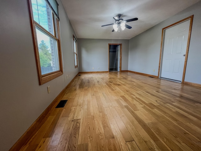 unfurnished room featuring ceiling fan and light hardwood / wood-style flooring