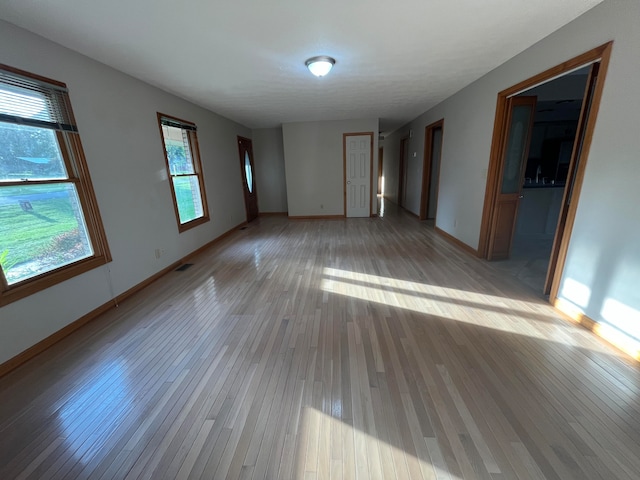 spare room featuring light hardwood / wood-style flooring