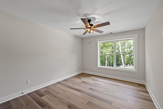 unfurnished room featuring light hardwood / wood-style flooring and ceiling fan