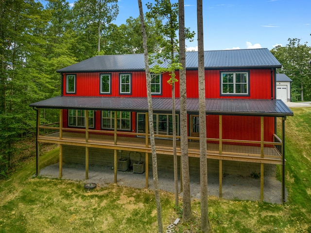 back of property featuring a wooden deck