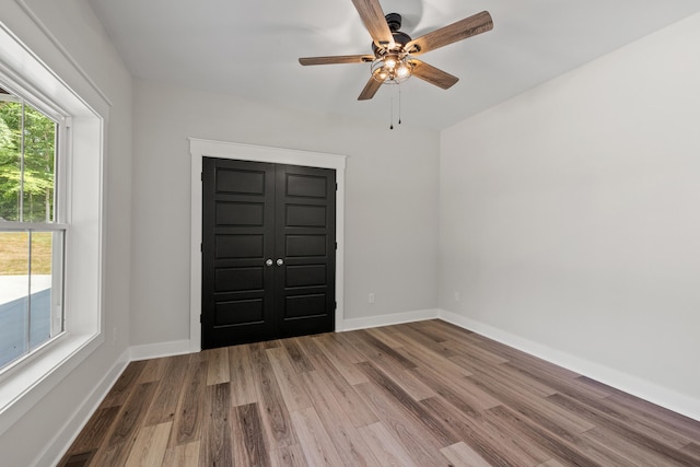 entryway with ceiling fan and hardwood / wood-style flooring