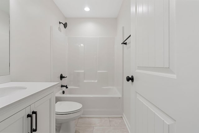 bathroom with toilet, shower / tub combination, and vanity