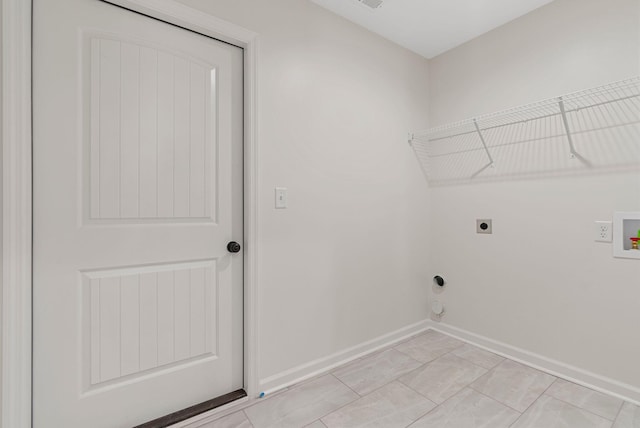 clothes washing area with baseboards, laundry area, washer hookup, and hookup for an electric dryer