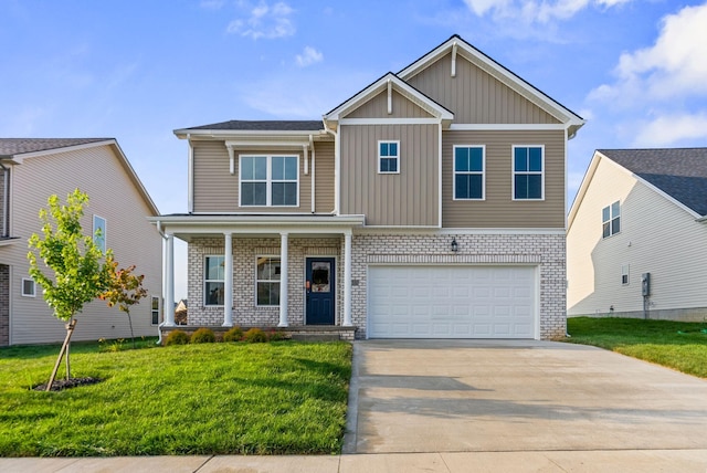 view of front of property featuring a front yard and a garage