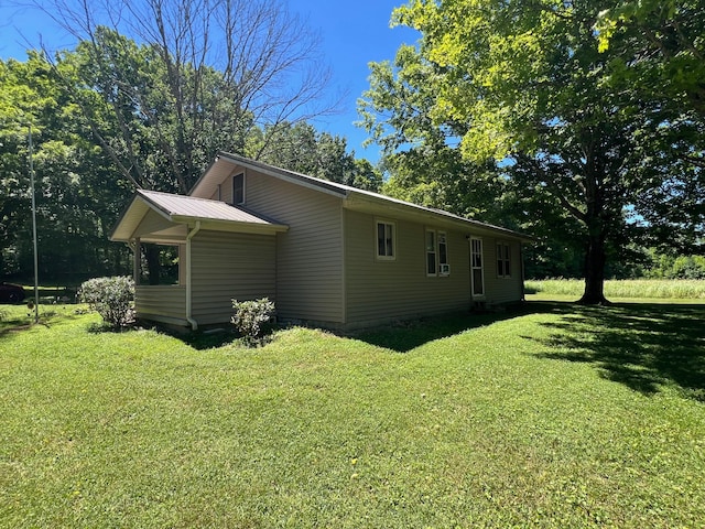 view of property exterior featuring a yard