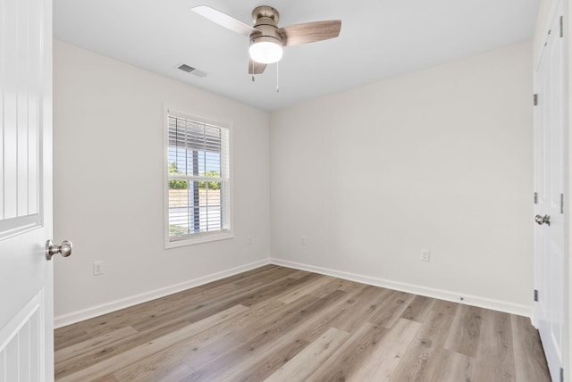 spare room with ceiling fan and light hardwood / wood-style floors