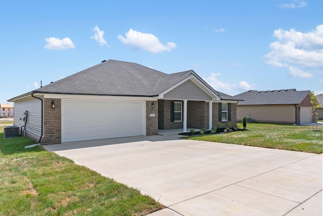 single story home with a front lawn, central AC unit, and a garage