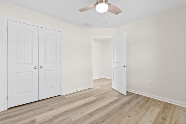 unfurnished bedroom featuring a closet, ceiling fan, and light hardwood / wood-style floors