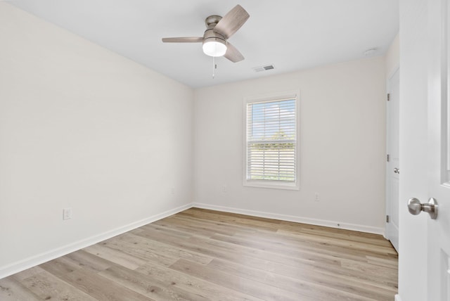 empty room featuring light wood-type flooring and ceiling fan