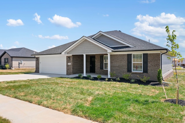 view of front of property featuring a front yard and a garage