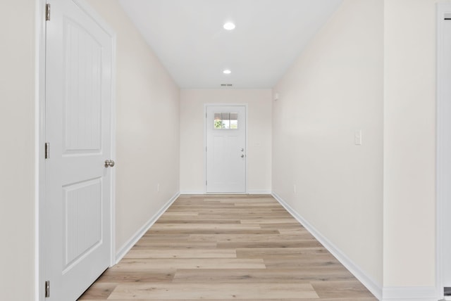 doorway to outside featuring light wood-type flooring