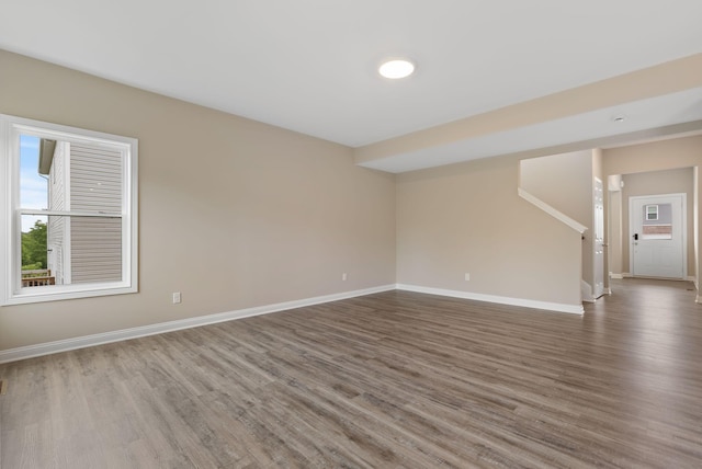 unfurnished room featuring hardwood / wood-style flooring