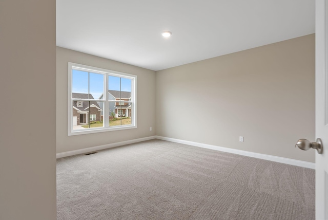 view of carpeted spare room