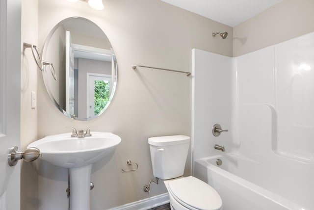 bathroom featuring toilet and tub / shower combination