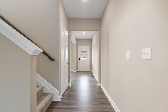 hallway featuring dark wood-type flooring