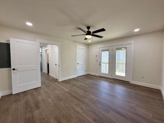 unfurnished room with recessed lighting, dark wood finished floors, and baseboards