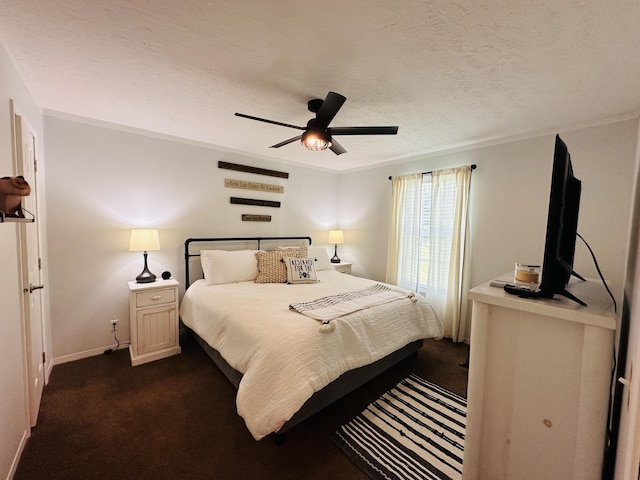 bedroom with dark colored carpet, a textured ceiling, and ceiling fan