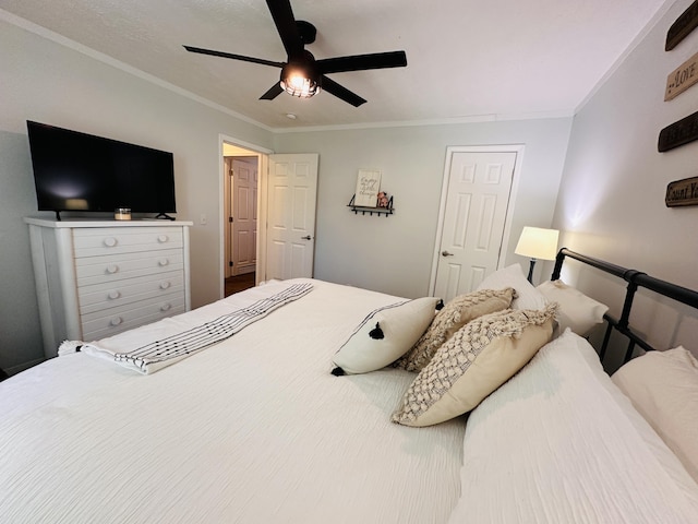 bedroom featuring ceiling fan and ornamental molding