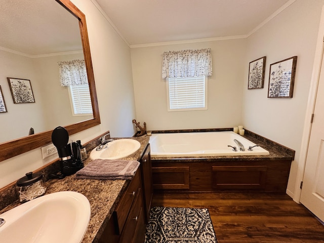 bathroom with vanity, a bath, wood-type flooring, and crown molding