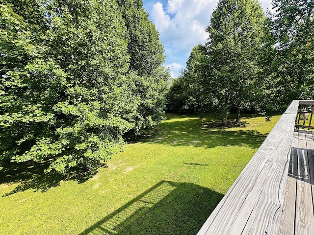 view of yard with a wooden deck