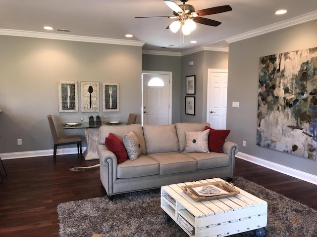 living room featuring ceiling fan, dark hardwood / wood-style floors, and ornamental molding