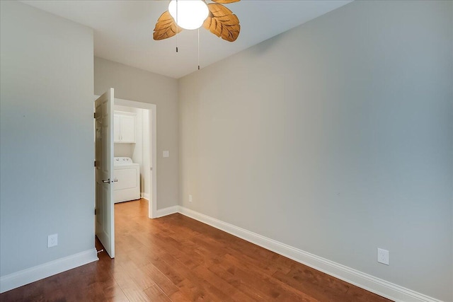 unfurnished room featuring hardwood / wood-style floors, ceiling fan, and washer / dryer