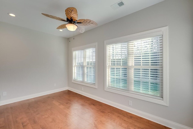 empty room featuring hardwood / wood-style flooring and ceiling fan