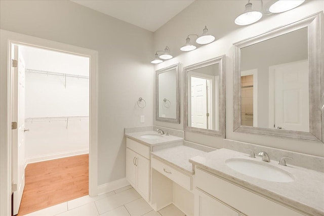 bathroom with tile patterned floors and vanity