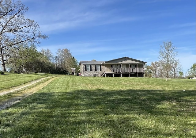 exterior space with a yard and a wooden deck