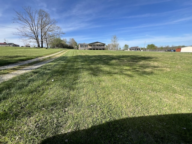 view of yard with a rural view