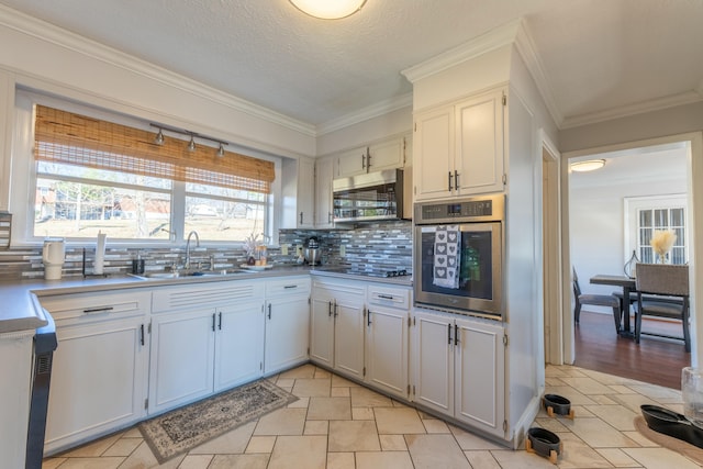 kitchen featuring white cabinetry, stainless steel appliances, and sink